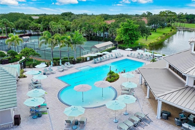 1940 Willow Bend Cir Unit 102, Naples, FL 34109 - community pool with a water view and view of wooded area