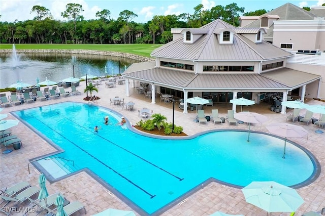 1940 Willow Bend Cir Unit 102, Naples, FL 34109 - community pool with a water view, a patio area, and outdoor dining space