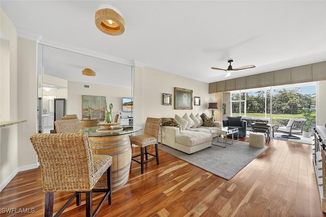 1940 Willow Bend Cir Unit 102, Naples, FL 34109 - living area with wood finished floors and a ceiling fan