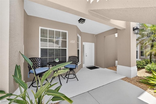 1940 Willow Bend Cir Unit 102, Naples, FL 34109 - view of exterior entry with stucco siding