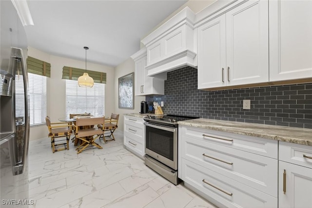 1940 Willow Bend Cir Unit 102, Naples, FL 34109 - kitchen with stainless steel appliances, light marble finish floors, decorative backsplash, and white cabinetry