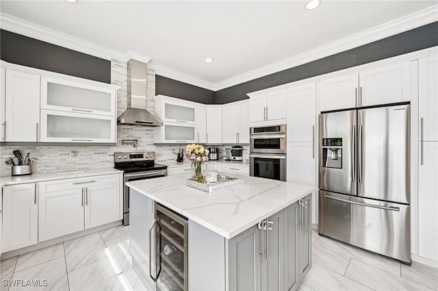 7082 Aliso Ave, West Palm Beach, FL 33413 - kitchen with appliances with stainless steel finishes, light marble finish floors, wine cooler, wall chimney exhaust hood, and recessed lighting