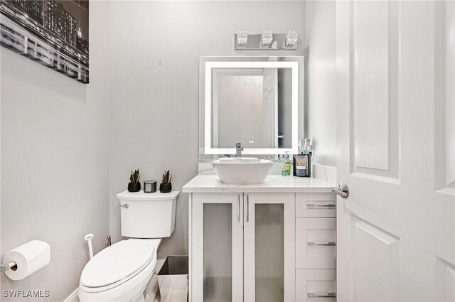 7082 Aliso Ave, West Palm Beach, FL 33413 - half bathroom with toilet and vanity