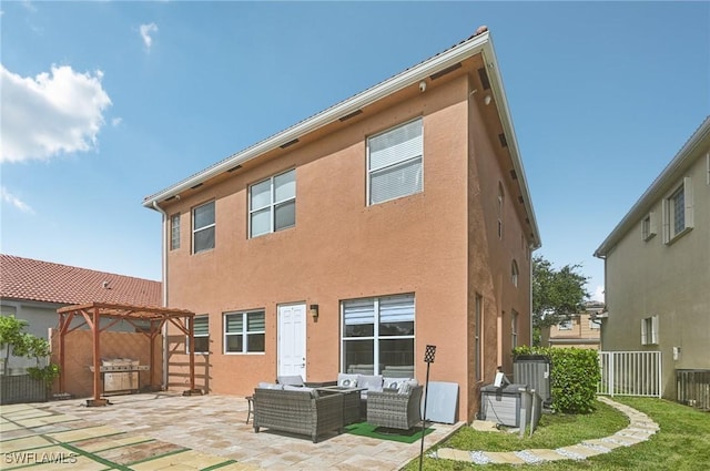 7082 Aliso Ave, West Palm Beach, FL 33413 - rear view of house featuring an outdoor living space, a pergola, a fenced backyard, a patio area, and stucco siding