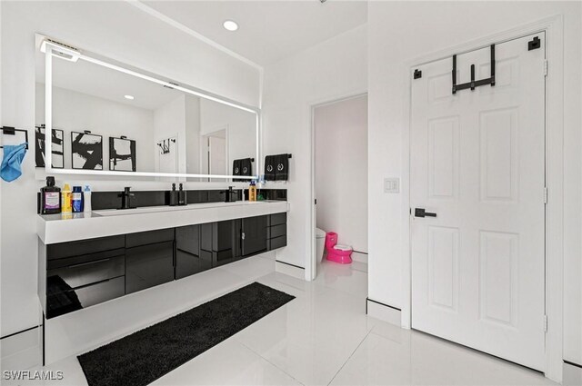 7082 Aliso Ave, West Palm Beach, FL 33413 - bathroom featuring vanity, tile patterned flooring, and recessed lighting