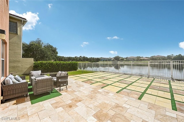 7082 Aliso Ave, West Palm Beach, FL 33413 - fenced backyard featuring a water view, a patio area, and an outdoor living space