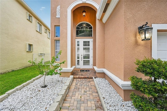 7082 Aliso Ave, West Palm Beach, FL 33413 - view of exterior entry featuring stucco siding
