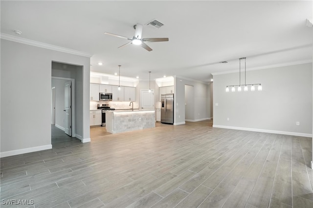 19270 Hinkley Dr, Estero, FL 33928 - unfurnished living room with a ceiling fan, crown molding, light wood-style floors, and recessed lighting
