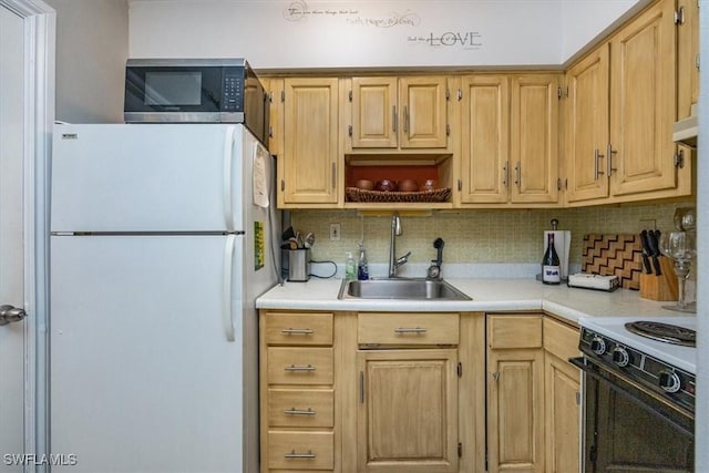 235 Seaview Ct Unit B2, Marco Island, FL 34145 - kitchen featuring white appliances, a sink, light brown cabinetry, light countertops, and decorative backsplash