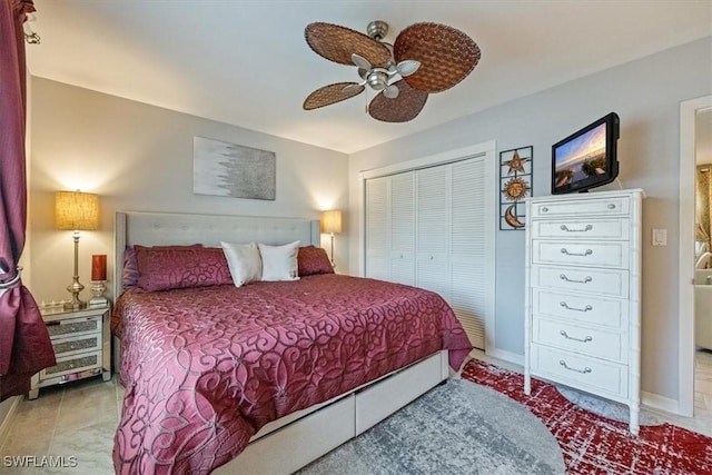 235 Seaview Ct Unit B2, Marco Island, FL 34145 - bedroom with a closet, ceiling fan, and baseboards