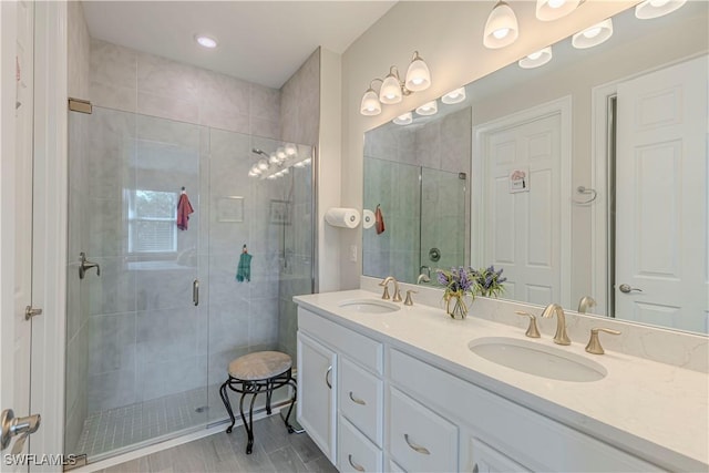 1050 Enbrook Loop, Naples, FL 34114 - bathroom featuring a stall shower and double vanity