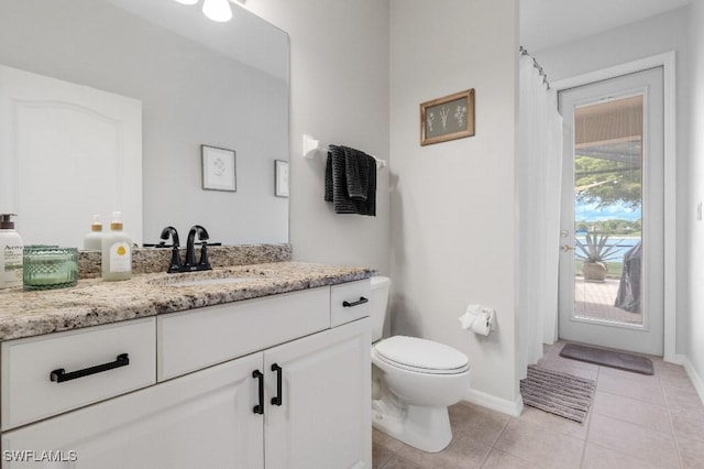 12455 Muddy Creek Ln, Fort Myers, FL 33913 - full bathroom with vanity, toilet, tile patterned floors, and baseboards