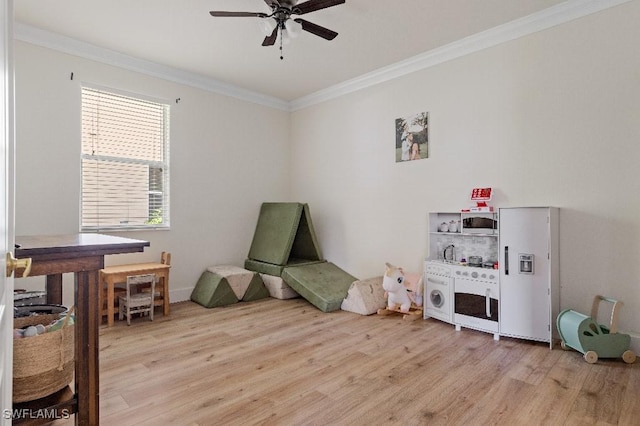 12455 Muddy Creek Ln, Fort Myers, FL 33913 - rec room with light wood-style flooring, ornamental molding, and a ceiling fan