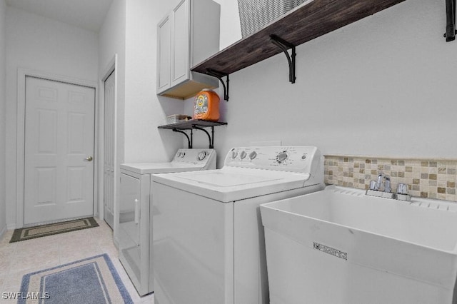 12455 Muddy Creek Ln, Fort Myers, FL 33913 - laundry room featuring cabinet space, washer and clothes dryer, and light tile patterned floors