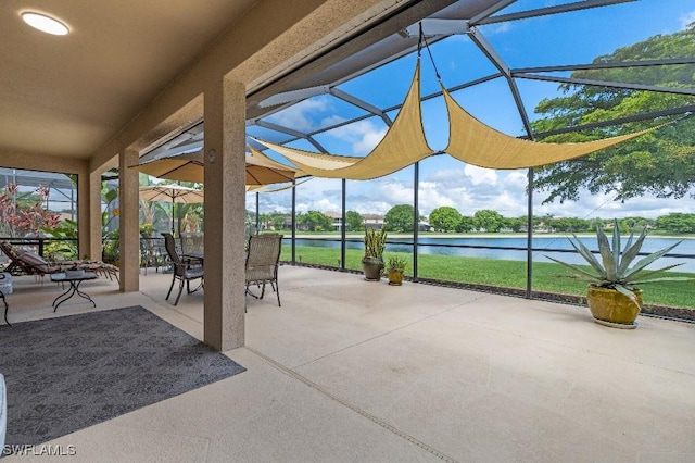 12455 Muddy Creek Ln, Fort Myers, FL 33913 - view of patio featuring a water view, glass enclosure, and outdoor dining space