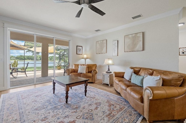 12455 Muddy Creek Ln, Fort Myers, FL 33913 - living room with crown molding, ceiling fan, light wood-style flooring, and baseboards