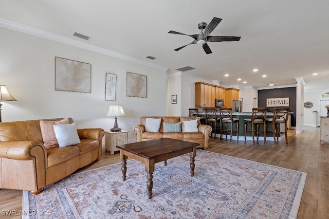 12455 Muddy Creek Ln, Fort Myers, FL 33913 - living room with crown molding, ceiling fan, light wood-style floors, recessed lighting, and baseboards