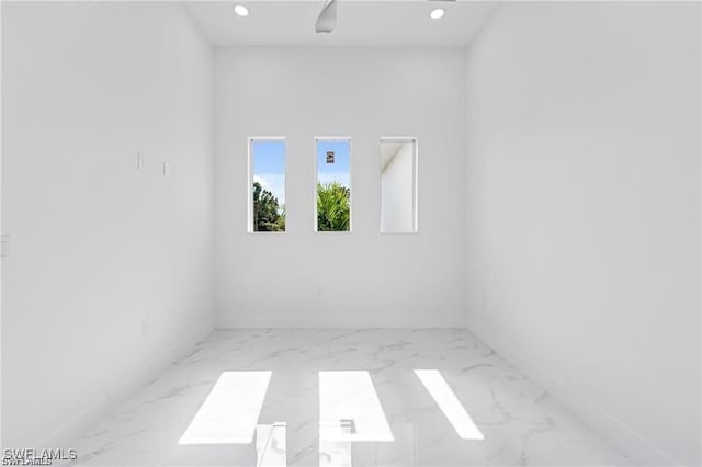 837 Grant Blvd, Lehigh Acres, FL 33974 - unfurnished room with marble finish floors, recessed lighting, and baseboards