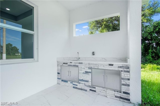 837 Grant Blvd, Lehigh Acres, FL 33974 - view of patio / terrace with an outdoor kitchen and a sink