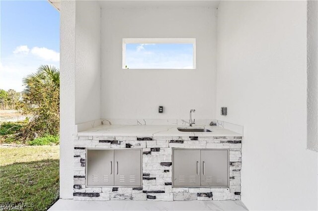 837 Grant Blvd, Lehigh Acres, FL 33974 - view of patio / terrace featuring an outdoor kitchen and a sink