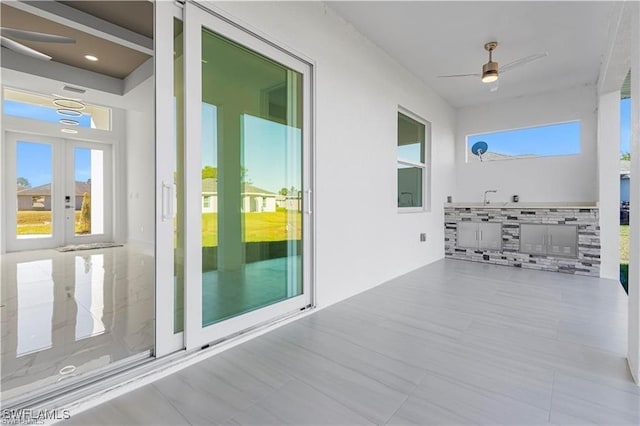 837 Grant Blvd, Lehigh Acres, FL 33974 - view of patio / terrace with an outdoor kitchen, a ceiling fan, and french doors