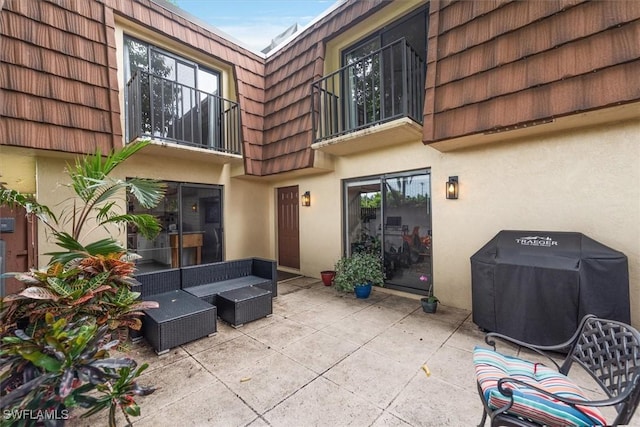 5249 Cedarbend Dr Unit 2, Fort Myers, FL 33919 - view of patio / terrace with a balcony, an outdoor living space, and a grill