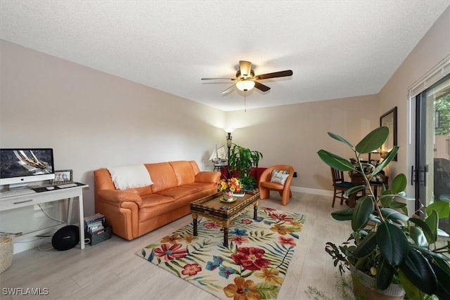 5249 Cedarbend Dr Unit 2, Fort Myers, FL 33919 - living area featuring wood finished floors, ceiling fan, a textured ceiling, and baseboards