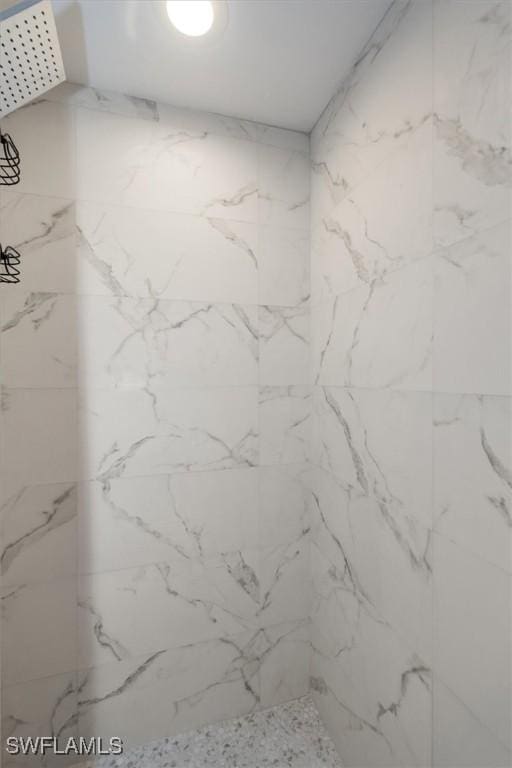 5249 Cedarbend Dr Unit 2, Fort Myers, FL 33919 - bathroom featuring a marble finish shower