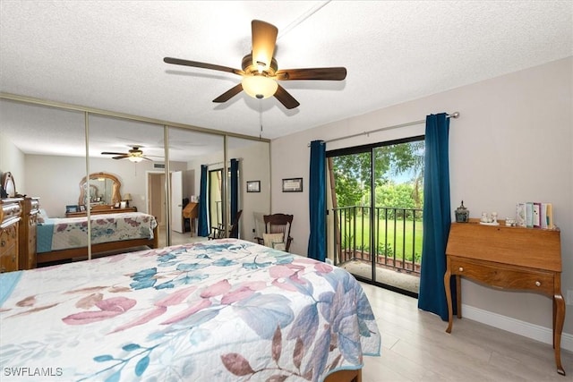 5249 Cedarbend Dr Unit 2, Fort Myers, FL 33919 - bedroom with access to exterior, light wood finished floors, baseboards, a ceiling fan, and a textured ceiling
