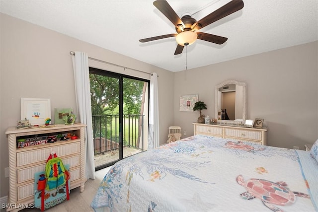 5249 Cedarbend Dr Unit 2, Fort Myers, FL 33919 - bedroom with access to exterior and a ceiling fan