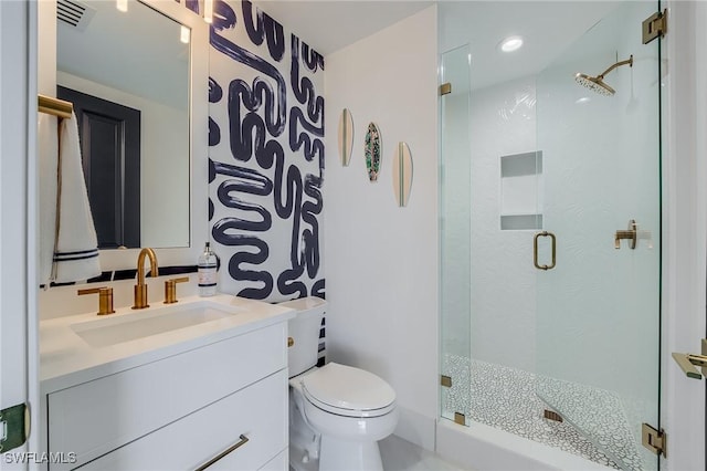 350 S Collier Blvd Unit 1103, Marco Island, FL 34145 - bathroom with toilet, a stall shower, and vanity