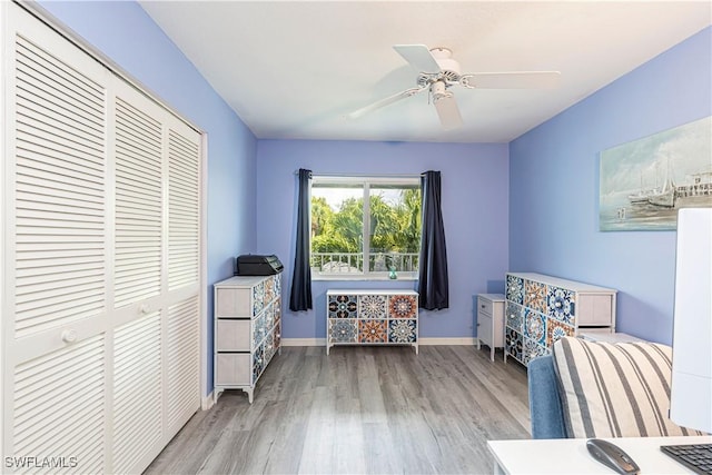 164 Belina Dr E Unit 4, Naples, FL 34104 - bedroom with wood finished floors, a closet, and a ceiling fan