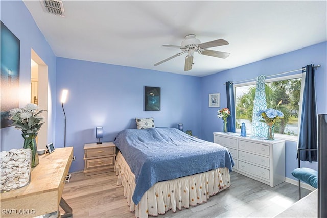 164 Belina Dr E Unit 4, Naples, FL 34104 - bedroom with light wood-style floors and ceiling fan