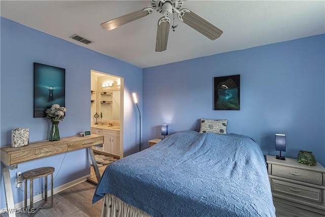 164 Belina Dr E Unit 4, Naples, FL 34104 - bedroom with wood finished floors, ceiling fan, and ensuite bath