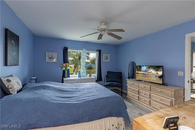 164 Belina Dr E Unit 4, Naples, FL 34104 - bedroom with wood finished floors and a ceiling fan