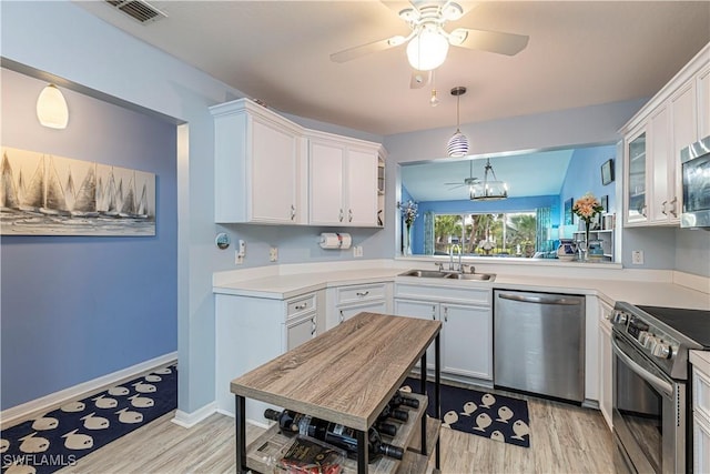 164 Belina Dr E Unit 4, Naples, FL 34104 - kitchen featuring appliances with stainless steel finishes, light wood-style floors, ceiling fan, and white cabinets