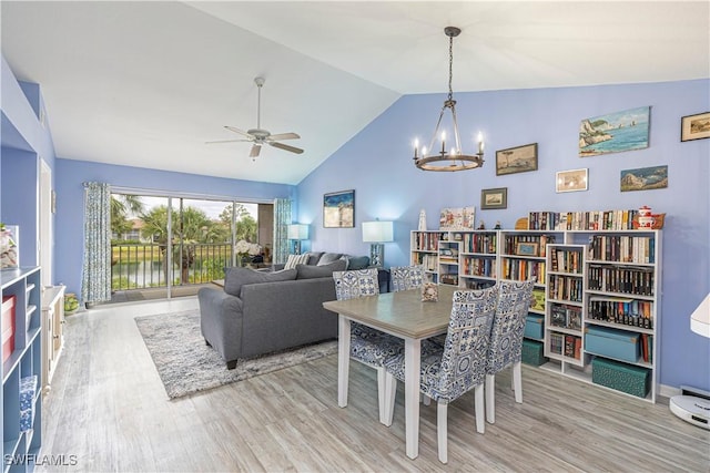 164 Belina Dr E Unit 4, Naples, FL 34104 - dining space featuring wood finished floors, a chandelier, vaulted ceiling, and ceiling fan