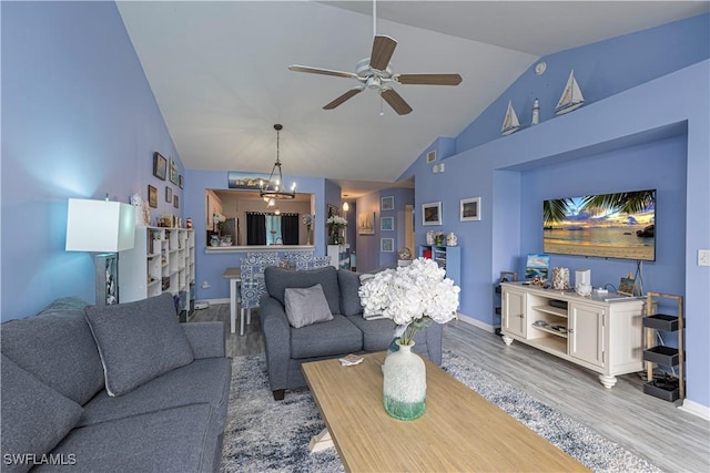 164 Belina Dr E Unit 4, Naples, FL 34104 - living area with a ceiling fan, wood finished floors, a chandelier, and high vaulted ceiling