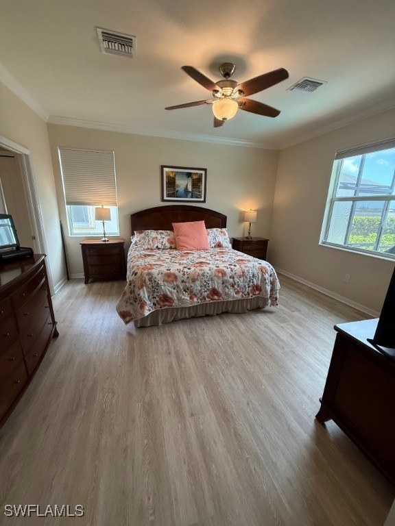 16249 Bonita Landing Cir, Bonita Springs, FL 34135 - bedroom featuring wood finished floors, baseboards, crown molding, and ceiling fan