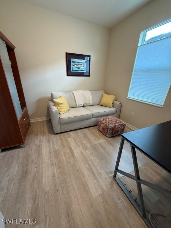 16249 Bonita Landing Cir, Bonita Springs, FL 34135 - living area featuring wood finished floors and baseboards