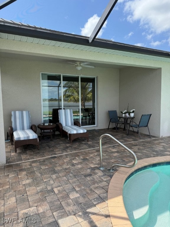 16249 Bonita Landing Cir, Bonita Springs, FL 34135 - swimming pool featuring a patio area, ceiling fan, and glass enclosure