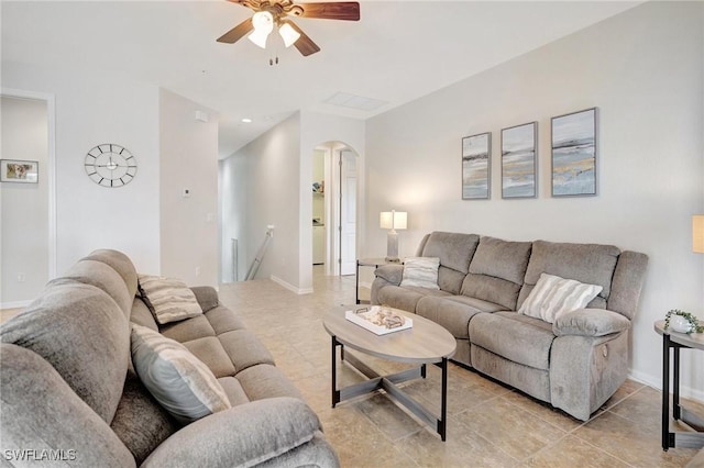 11830 Paseo Grande Blvd Unit 4608, Fort Myers, FL 33912 - living room featuring arched walkways, ceiling fan, light tile patterned floors, and baseboards