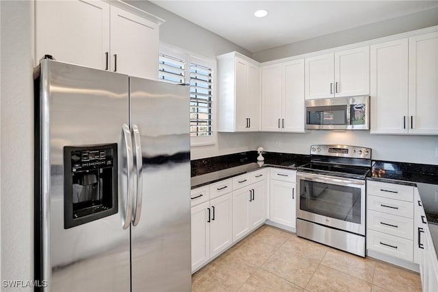 11830 Paseo Grande Blvd Unit 4608, Fort Myers, FL 33912 - kitchen featuring appliances with stainless steel finishes, white cabinetry, light tile patterned flooring, dark stone countertops, and recessed lighting