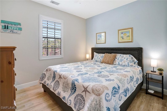 11830 Paseo Grande Blvd Unit 4608, Fort Myers, FL 33912 - bedroom featuring wood finished floors and baseboards