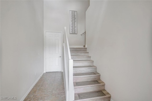 11830 Paseo Grande Blvd Unit 4608, Fort Myers, FL 33912 - stairway with baseboards and tile patterned floors