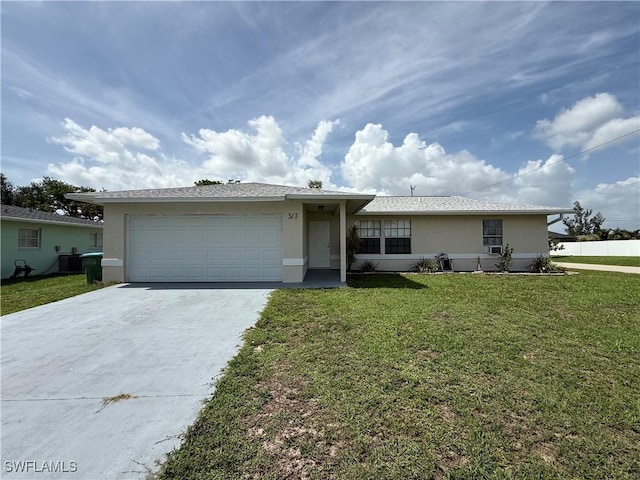317 SE 14th Ter, Cape Coral, FL 33990 - single story home featuring stucco siding, driveway, an attached garage, and a front lawn