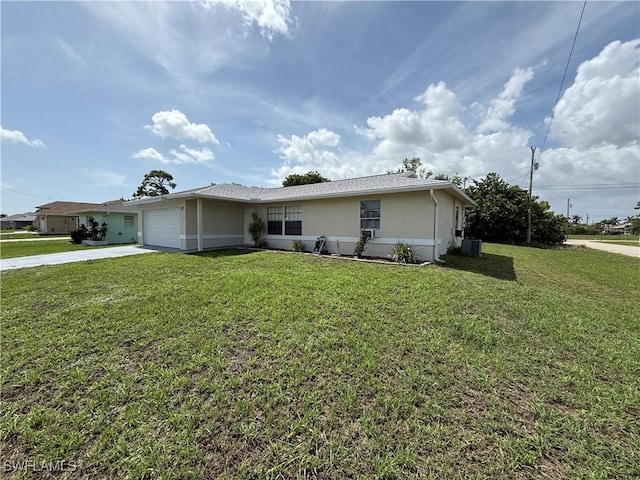 317 SE 14th Ter, Cape Coral, FL 33990 - ranch-style house featuring driveway, stucco siding, a garage, and a front yard