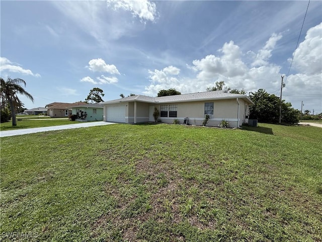 317 SE 14th Ter, Cape Coral, FL 33990 - ranch-style house with driveway, a garage, a front lawn, and stucco siding