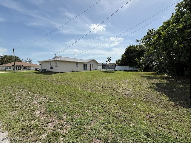 317 SE 14th Ter, Cape Coral, FL 33990 - view of yard featuring a trampoline