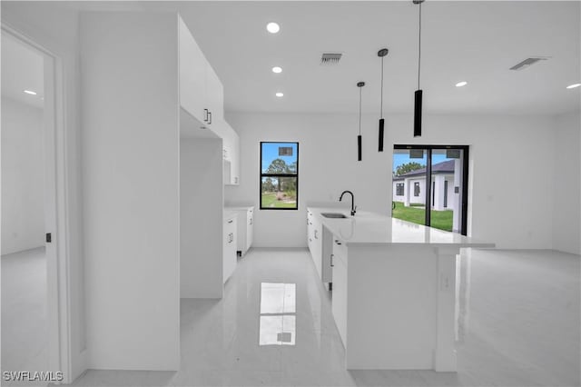 643 Knapp St, Lehigh Acres, FL 33974 - kitchen with modern cabinets, white cabinets, light countertops, recessed lighting, and plenty of natural light